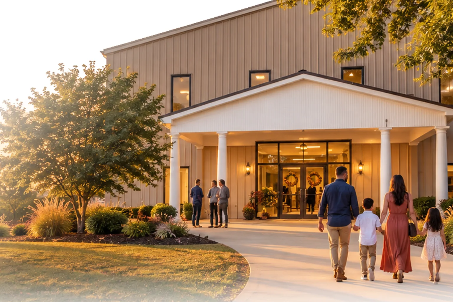 Family walking into church at sunset